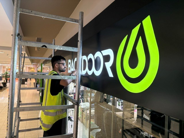 Sunnies on for the Illuminated Backdoor shopfront sign, building signage Rotorua by StarSign